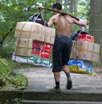 Porter carrying supplies up mountain